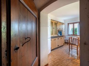 an open door to a kitchen with a table at Holiday Home Il Castelliere-1 by Interhome in Rive dʼArcano
