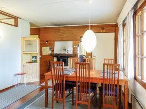 a dining room with a wooden table and chairs at Holiday Home Saariseläntie 8 a 1 by Interhome in Saariselka