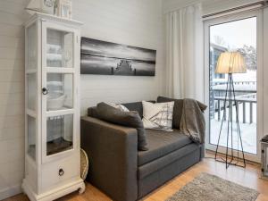 a living room with a gray couch and a window at Holiday Home Willa anna b by Interhome in Dragsfjärd