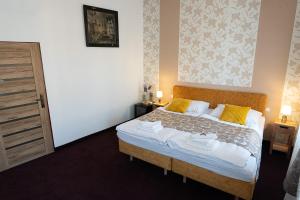 Postel nebo postele na pokoji v ubytování Penzión Deloris