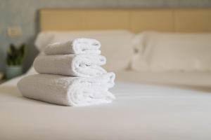 Postel nebo postele na pokoji v ubytování Hotel L'Aretino