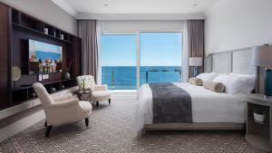 Ein Bett oder Betten in einem Zimmer der Unterkunft Royal Palm Hotel