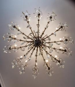 a chandelier hanging from a ceiling at Apollofirst Boutique Hotel in Amsterdam