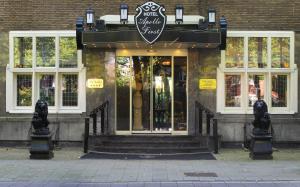 a store front of a building with the door open at Apollofirst Boutique Hotel in Amsterdam