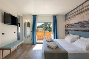 Posteľ alebo postele v izbe v ubytovaní Tuscany Hotel Alle Dune