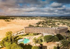 an aerial view of a resort with a swimming pool at Evora Hotel in Évora
