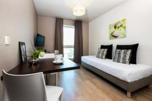 אזור ישיבה ב-Ténéo Apparthotel Bordeaux Gare Saint Jean