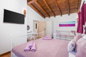 Postel nebo postele na pokoji v ubytování Villa LAVANTINA
