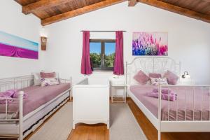 Postel nebo postele na pokoji v ubytování Villa LAVANTINA