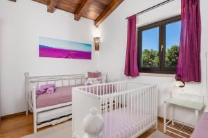 Postel nebo postele na pokoji v ubytování Villa LAVANTINA