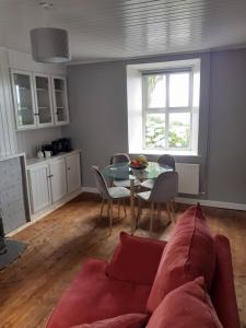 a living room with a couch and a table at Gleann Loic Farmhouse in Dingle