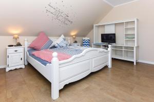 Postel nebo postele na pokoji v ubytování Ferienwohnung Haus Heimathafen