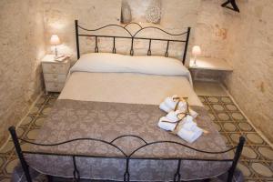 Postel nebo postele na pokoji v ubytování Trullo Sweet Trullo