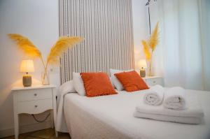 מיטה או מיטות בחדר ב-Hostal Restaurante Benalup Golf