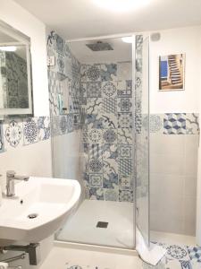 a bathroom with a shower and a sink at Regina Margherita in Positano