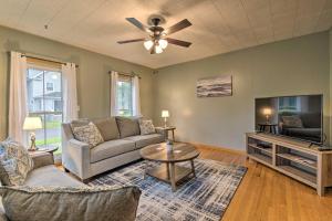 a living room with a couch and a tv at Penn Yan Escape with Yard, 1 Mi to Keuka Lake! in Penn Yan
