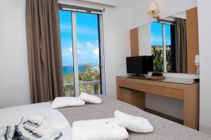 Postel nebo postele na pokoji v ubytování Phaistos Hotel
