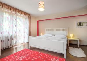 Postel nebo postele na pokoji v ubytování Dorf Residenz