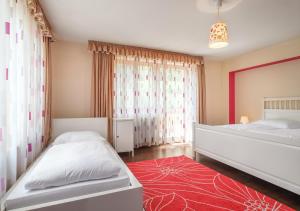 Postel nebo postele na pokoji v ubytování Dorf Residenz