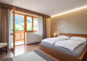 Postel nebo postele na pokoji v ubytování Dorf Residenz