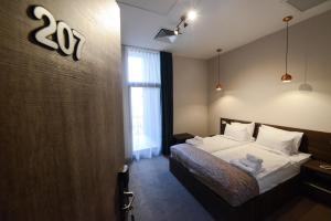 Ένα ή περισσότερα κρεβάτια σε δωμάτιο στο Hotel Cara 28