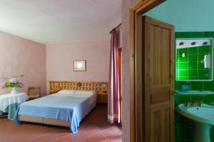 Postel nebo postele na pokoji v ubytování Hotel Scintilla