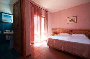 Postel nebo postele na pokoji v ubytování Hotel Scintilla
