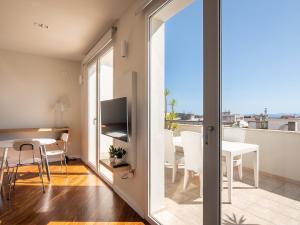 Televízia a/alebo spoločenská miestnosť v ubytovaní Penthouse center
