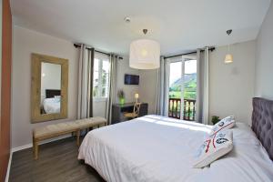 Letto o letti in una camera di Hotel Agian - Maison Bonnet
