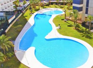 an overhead view of a large swimming pool on a building at Gemelos 26-Fincas Benidorm in Benidorm