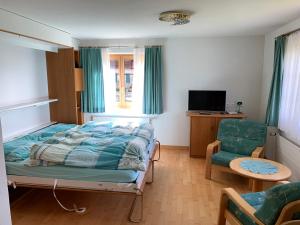 Postel nebo postele na pokoji v ubytování Schönegg Studio