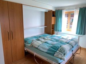 Postel nebo postele na pokoji v ubytování Schönegg Studio