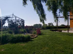a garden with a playground in the background at Agriturismo Raimondi Cominesi Amilcare in Garlasco