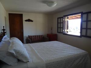 Un pat sau paturi într-o cameră la Villa Piccola Italia