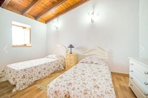 Posteľ alebo postele v izbe v ubytovaní La casa del bisa