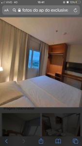 a picture of a bedroom with a bed and a window at Salinas Exclusive Resort in Salinópolis