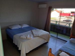 Postel nebo postele na pokoji v ubytování POUSADA ALEFER
