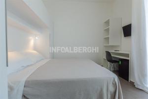 Postel nebo postele na pokoji v ubytování Hotel Niagara