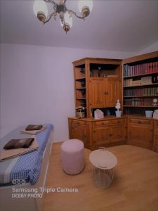 a bedroom with a bed and a book shelf at Debby in Rijeka