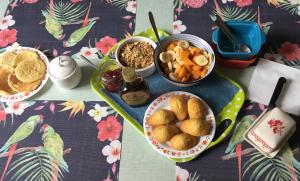 a table with plates of food on a table at un dimanche chez Julie chambre Célestine in Parthenay +13 photos