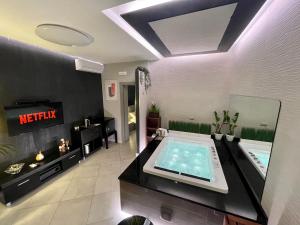 A television and/or entertainment centre at Suite Catania Lungomare