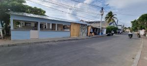 a blue building on the side of a street at Casa Hostel San Andres in San Andrés