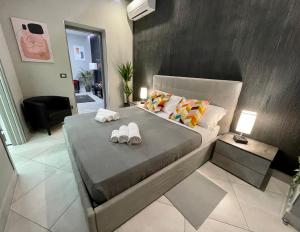 A bed or beds in a room at Suite Catania Lungomare