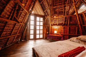 a bedroom with a bed in a wooden building at City Villa in Arusha