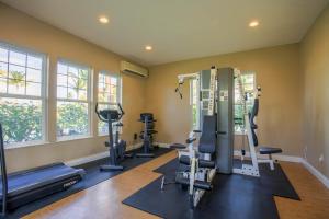 a gym with treadmills and exercise equipment in a room at Waikoloa Colony Villas 2202 in Waikoloa