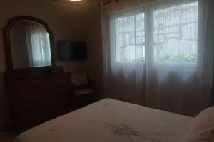 A bed or beds in a room at As Campanillas