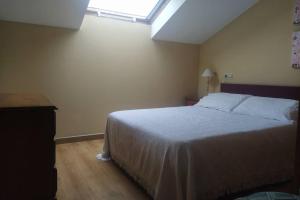 A bed or beds in a room at As Campanillas