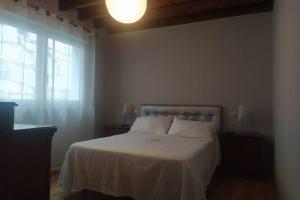 A bed or beds in a room at As Campanillas