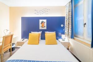 Кровать или кровати в номере Hotel Het Gheestelic Hof by CW Hotel Collection