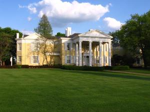 a large white house with a large lawn at Holiday Inn Express & Suites - Moundsville by IHG in Moundsville